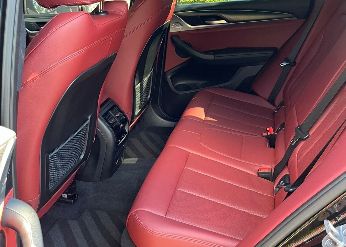 BMW red leather interior detailed by J's Car Detailing