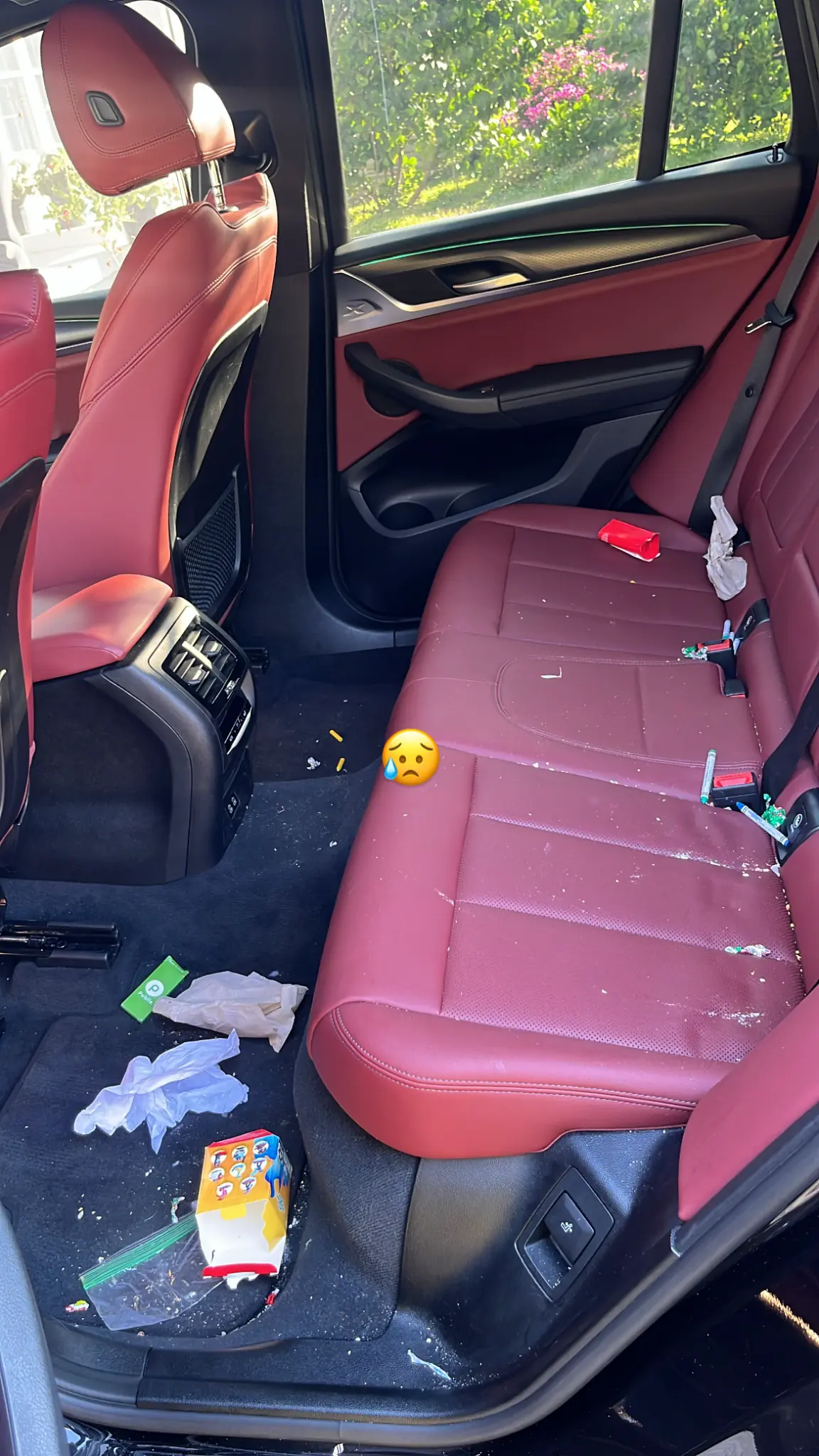 Dirty car backseat before professional mobile detailing in West Palm Beach